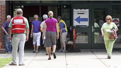 Patients come and go at a temporary health clinic on Friday at a school in Stratham, N.H. The state health department set up the clinic to test hundreds of people for hepatitis C related to an outbreak at nearby Exeter Hospital. David Kwiatkowski, who worked at the cardiac catheterization laboratory at the hospital, was charged with causing the outbreak.