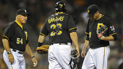Pirates starting pitcher Kevin Correia gets a visit to the mound from pitching coach Ray Searage in the sixth inning Tuesday night at PNC Park.