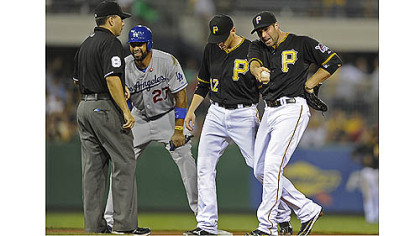 Pirates' Neil Walker argues a safe call at second base on Dodgers' Matt Kemp in the fourth inning Tuesday night at PNC Park.