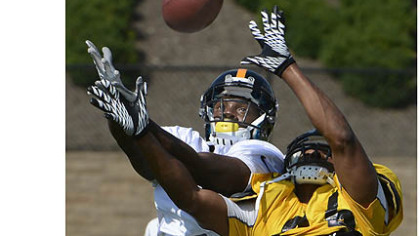 Steelers wide receiver Marquis Maze is defended by safety Will Allen during drills.
