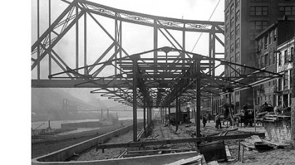 View of the farmers market when it was under construction on the Monongahela River wharf along Water Street in 1915.