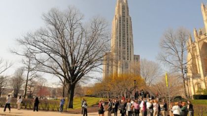 People wait along South Bellefield Avenue in March after being evacuated from the Cathedral of Learning at the University of Pittsburgh because of a bomb threat, one of many that had interrupted classes for months.